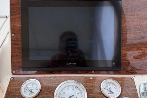 Slide: The Image of Dashboard of 2005 Albemarle 248 Express Fisherman with Garmin display and gauges. - 11
