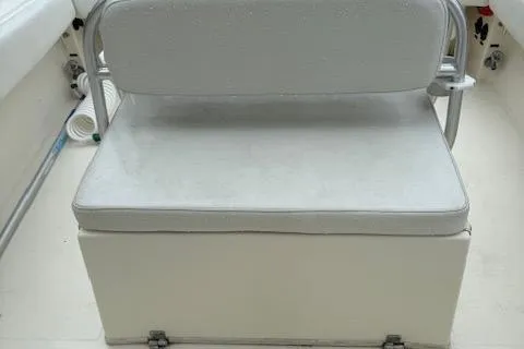 Slide: The Image of 2005 Albemarle 248 Express Fisherman boat seat with white cushioned bench. - 15