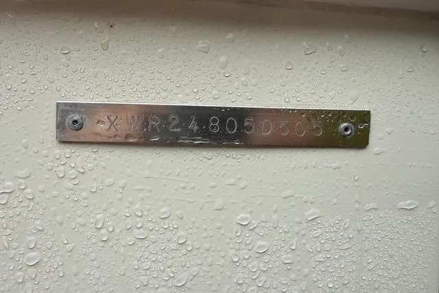 Slide: The Image of Metal identification plate on 2005 Albemarle 248 Express Fisherman, wet with water droplets. - 29