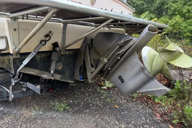 Slide: The Image of 2005 Albemarle 248 Express Fisherman boat with visible propeller and outboard motor. - 4