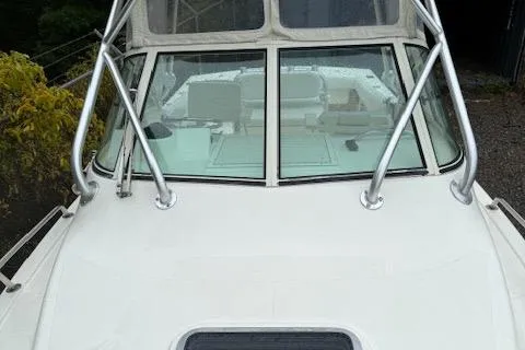 Slide: The Image of 2005 Albemarle 248 Express Fisherman boat with windshield and metal railings. - 5