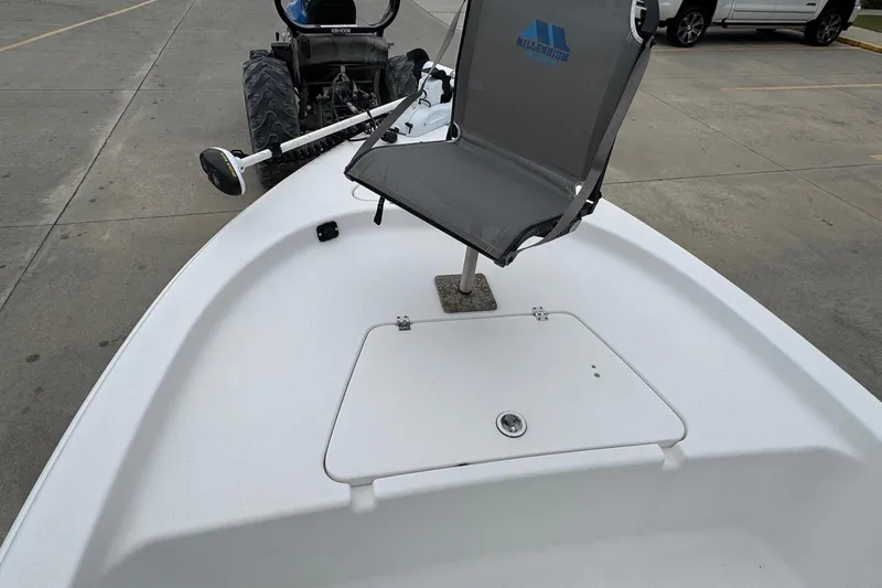 Slide: The Image of 2015 Tidewater 1800 Bay Max boat with mounted chair and trolling motor. - 13