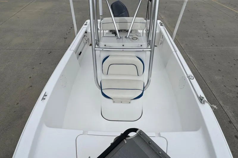 Slide: The Image of 2015 Tidewater 1800 Bay Max boat interior with seating and console. - 16