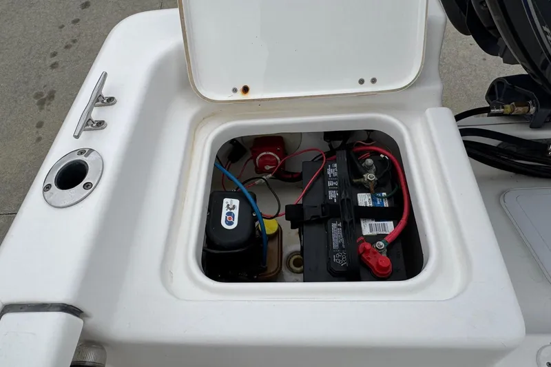 Slide: The Image of 2015 Tidewater 1800 Bay Max boat battery compartment with wiring and components. - 8