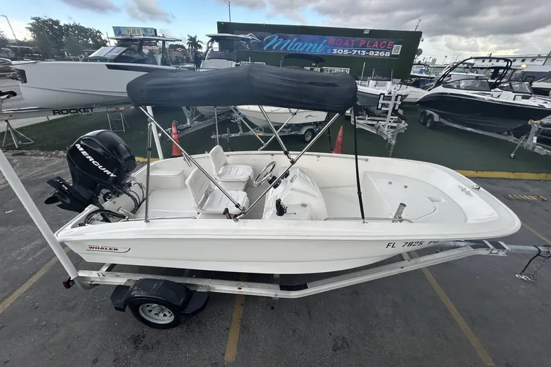 Slide: The Image of 2011 Boston Whaler 160 Super Sport boat on trailer at Miami Boat Place. - 12