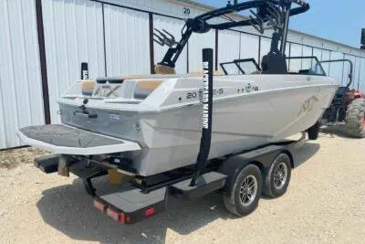 Slide: The Image of 2026 ATX Surf Boats 20 Type-S on trailer, parked outdoors. - 3