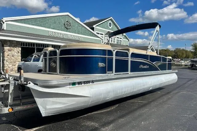 The Image of 2014 Manitou 24 Oasis SR pontoon boat at Reeds Marine, blue and white design. - 0
