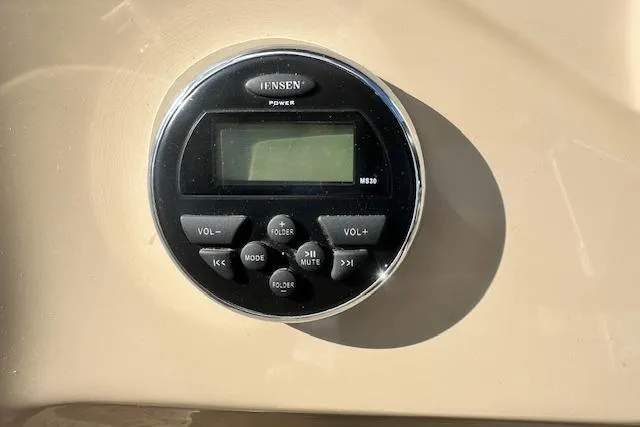 Slide: The Image of Jensen MS30 stereo system on 2014 Manitou 24 Oasis SR boat dashboard. - 14
