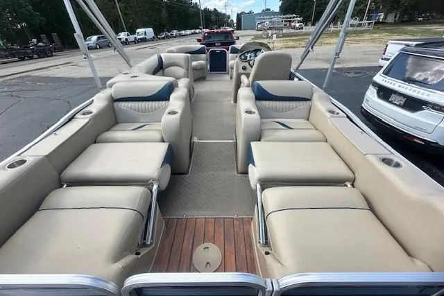 Slide: The Image of 2014 Manitou 24 Oasis SR pontoon boat with spacious seating and modern design. - 5