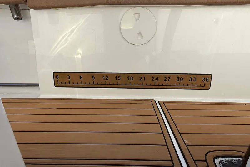 Slide: The Image of 2022 Sea Hunt Ultra 275 SE boat deck with built-in measuring ruler. - 24