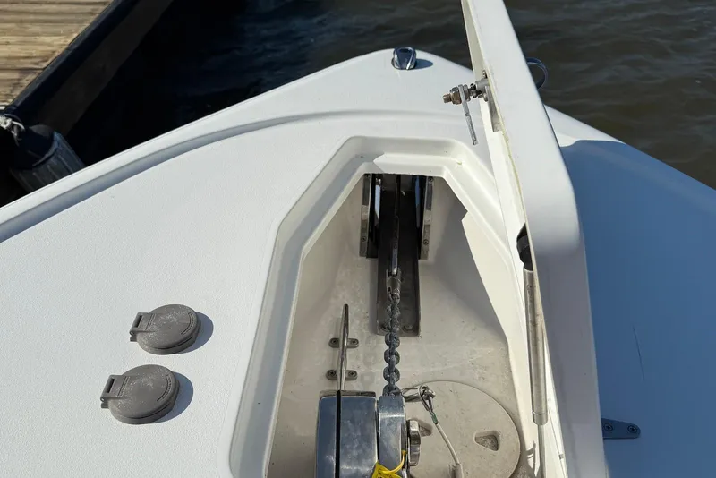 Slide: The Image of Anchor compartment of 2022 Sea Hunt Ultra 275 SE boat at dock. - 28