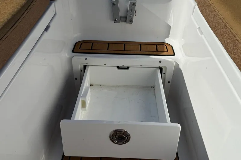 Slide: The Image of Open storage drawer on 2022 Sea Hunt Ultra 275 SE boat. - 31