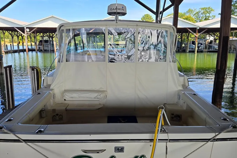 Slide: The Image of Control panel of a 1996 Tiara Yachts 3700 Open with navigation display and gauges. - 30