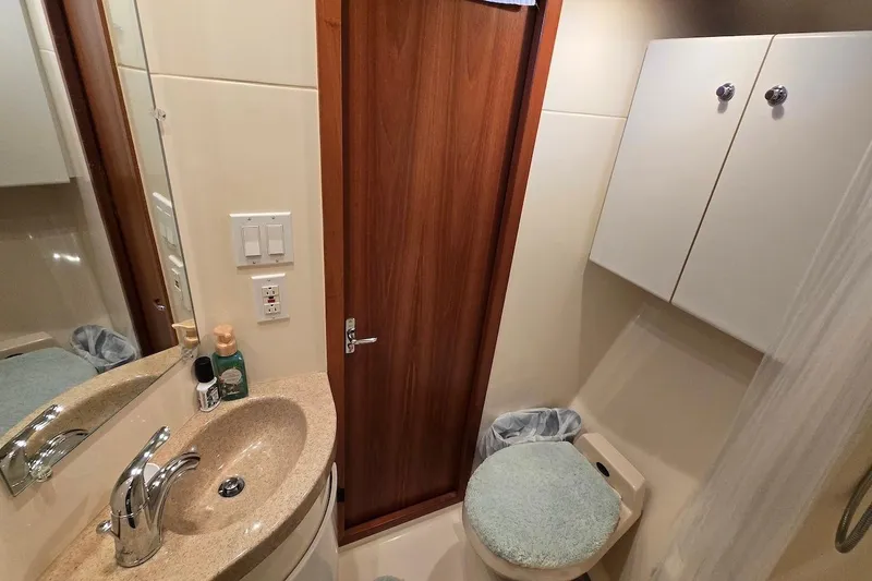 Slide: The Image of 1996 Tiara Yachts 3700 Open interior with cozy seating and wooden accents. - 37