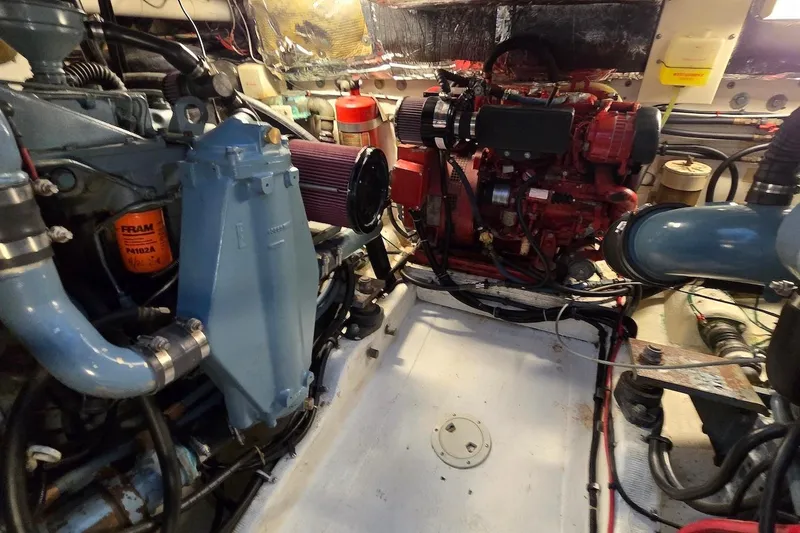 Slide: The Image of Engine room of a 1996 Tiara Yachts 3700 Open, showcasing mechanical components. - 50