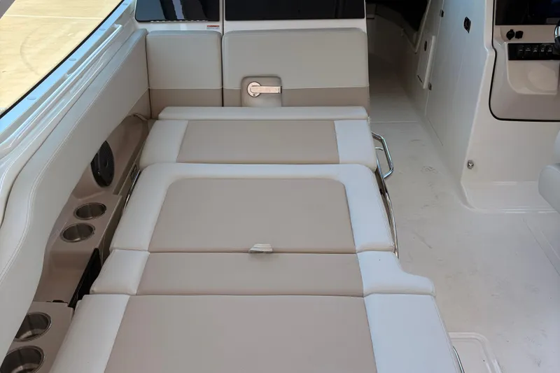 Slide: The Image of Red-lit interior of 2025 Boston Whaler 280 Vantage boat, showcasing modern design. - 12