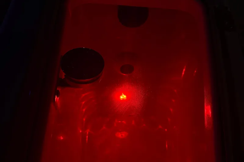 Slide: The Image of 2025 Boston Whaler 280 Vantage boat with outboard motor in a marina setting. - 2