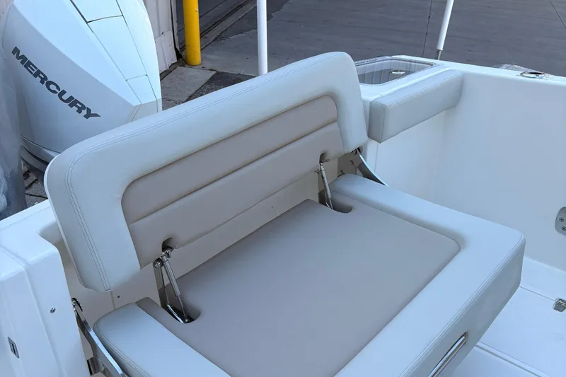 Slide: The Image of 2025 Boston Whaler 280 Vantage boat bathroom with sink and portable toilet. - 8