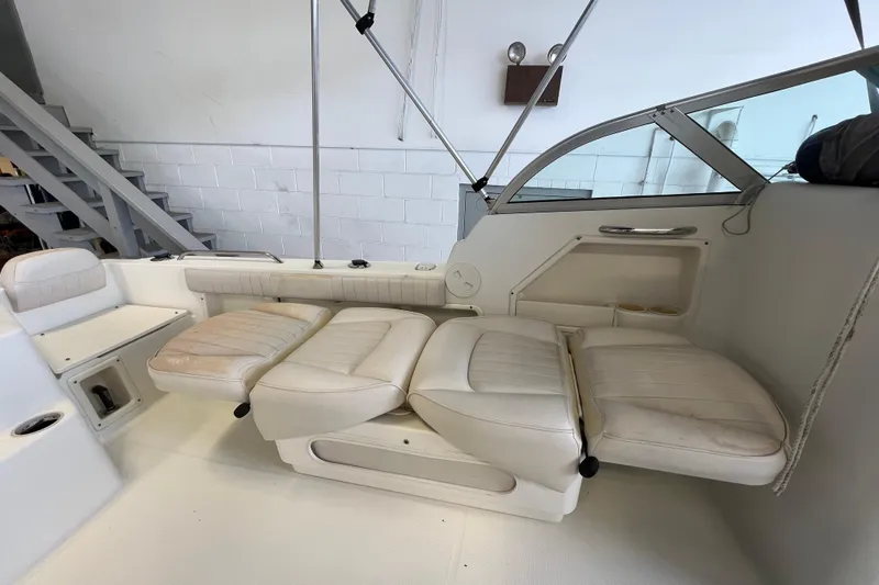Slide: The Image of 2006 Hydra-Sports Lightning 202 DC boat interior with white leather seating. - 13