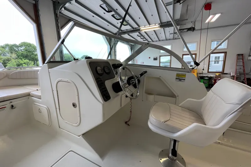 Slide: The Image of 2006 Hydra-Sports Lightning 202 DC boat interior with steering wheel and seating. - 14