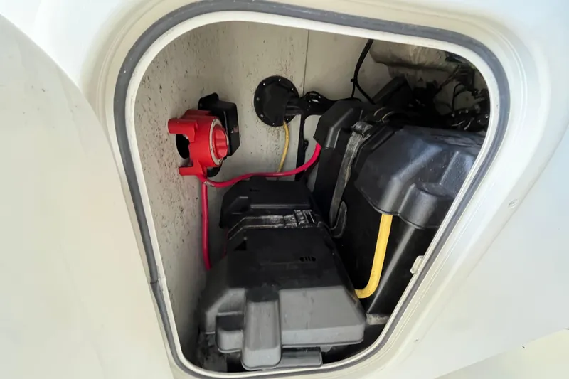 Slide: The Image of 2006 Hydra-Sports Lightning 202 DC battery compartment with wiring and switch. - 19