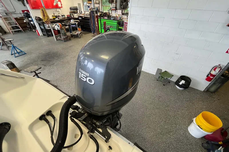 Slide: The Image of 2006 Hydra-Sports Lightning 202 DC with Yamaha 150 engine in a workshop setting. - 26