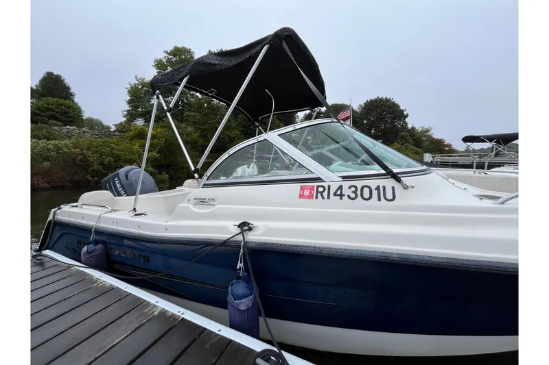 Slide: The Image of 2006 Hydra-Sports Lightning 202 DC boat docked, featuring a Yamaha engine and canopy. - 3
