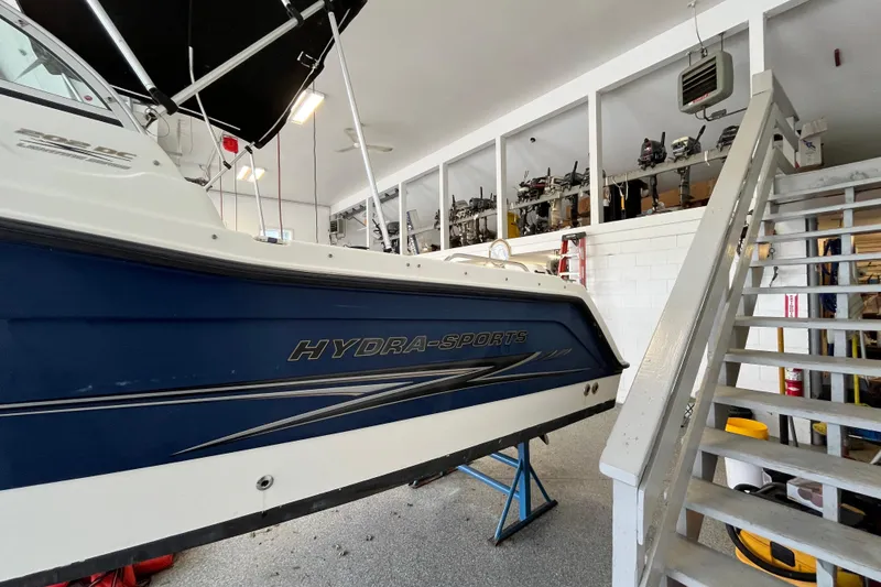 Slide: The Image of 2006 Hydra-Sports Lightning 202 DC boat in a garage, side view. - 34