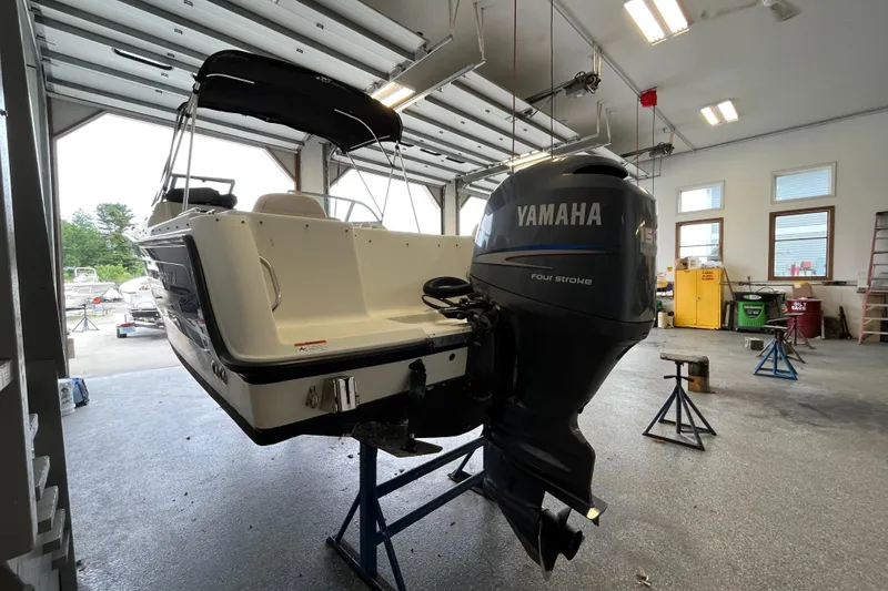 Slide: The Image of 2006 Hydra-Sports Lightning 202 DC boat with Yamaha outboard in a garage setting. - 35