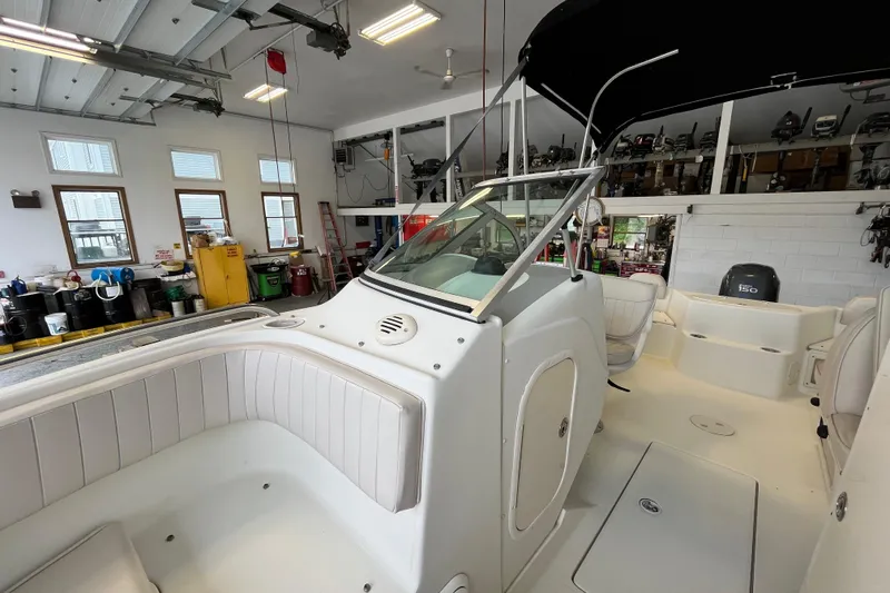 Slide: The Image of 2006 Hydra-Sports Lightning 202 DC boat interior in a garage setting. - 9