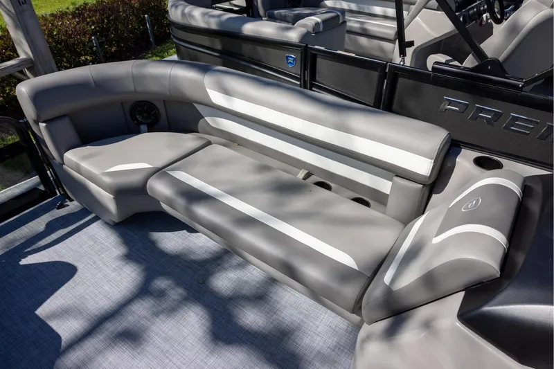 Slide: The Image of Luxurious seating on 2026 Premier 200 Sunscape RF pontoon boat, featuring sleek gray upholstery. - 12