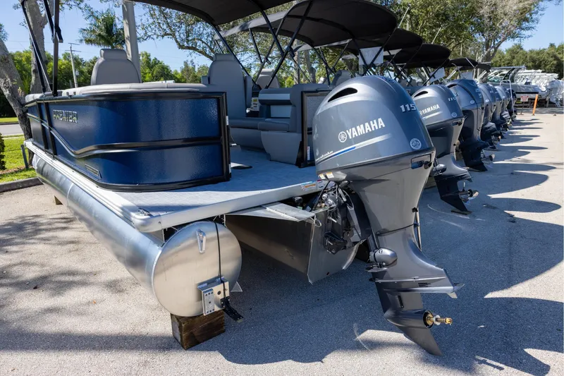 Slide: The Image of 2026 Premier 200 Sunscape RF pontoon boat with Yamaha outboard engines, parked outdoors. - 2