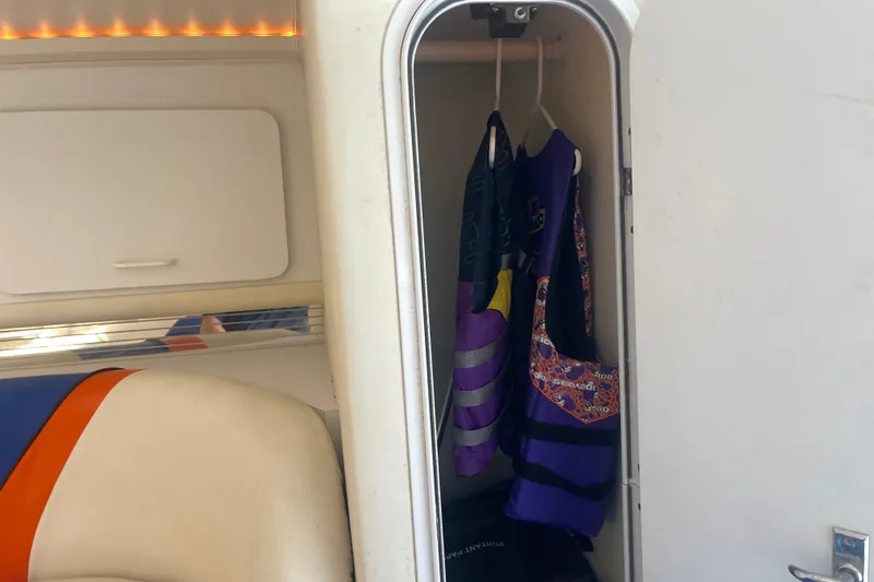 Slide: The Image of Interior of 1995 Excel Scarab 43 boat with life jackets in a closet. - 29