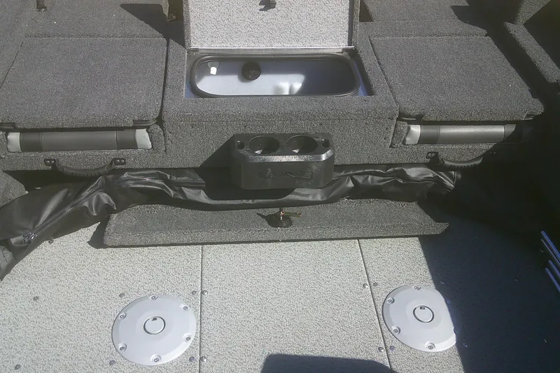 Slide: The Image of Interior of 2026 Lund 1775 Adventure Sport boat with storage compartments and cup holders. - 13