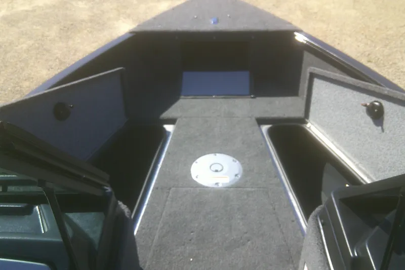 Slide: The Image of 2026 Lund 1775 Adventure Sport boat interior with storage compartments open. - 4