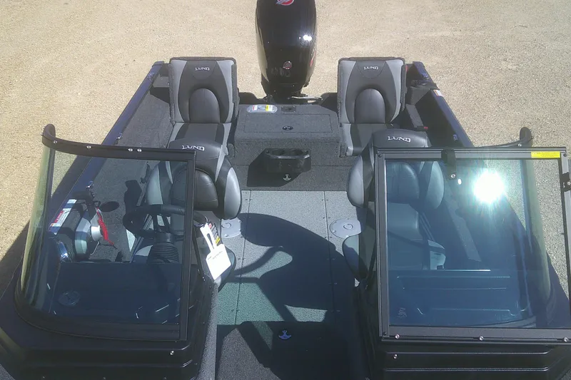 Slide: The Image of 2026 Lund 1775 Adventure Sport boat interior with seating and windshield. - 7