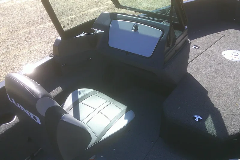 Slide: The Image of 2026 Lund 1775 Adventure Sport boat interior with seating and storage compartments. - 8