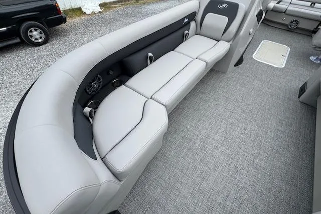 Slide: The Image of 2026 Barletta ARIA 24 UC boat interior with gray seating and carpeted flooring. - 12