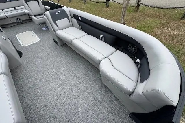 Slide: The Image of Luxurious seating on 2026 Barletta ARIA 24 UC pontoon boat, featuring sleek gray upholstery. - 13
