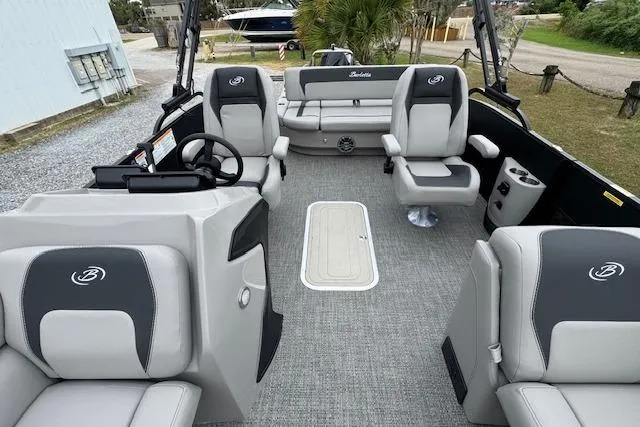 Slide: The Image of 2026 Barletta ARIA 24 UC pontoon boat interior with plush seating and modern design. - 14