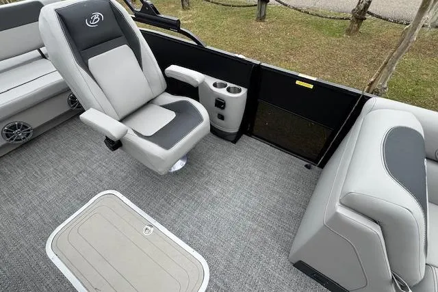 Slide: The Image of 2026 Barletta ARIA 24 UC boat interior with gray seating and carpeted flooring. - 15