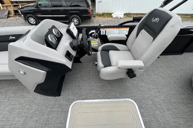 Slide: The Image of Captain's chair and helm of 2026 Barletta ARIA 24 UC pontoon boat, featuring modern controls. - 16