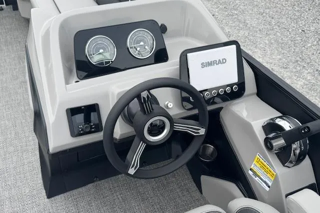 Slide: The Image of 2026 Barletta ARIA 24 UC boat dashboard with steering wheel and Simrad display. - 17