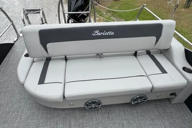 Slide: The Image of 2026 Barletta ARIA 24 UC boat seating with gray upholstery and integrated speakers. - 19