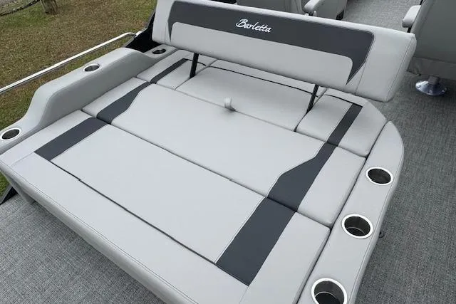 Slide: The Image of 2026 Barletta ARIA 24 UC boat seating with cup holders, gray upholstery, and adjustable backrest. - 20