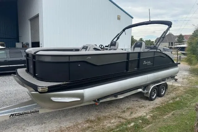 Slide: The Image of 2026 Barletta ARIA 24 UC pontoon boat on trailer, parked outdoors. - 8