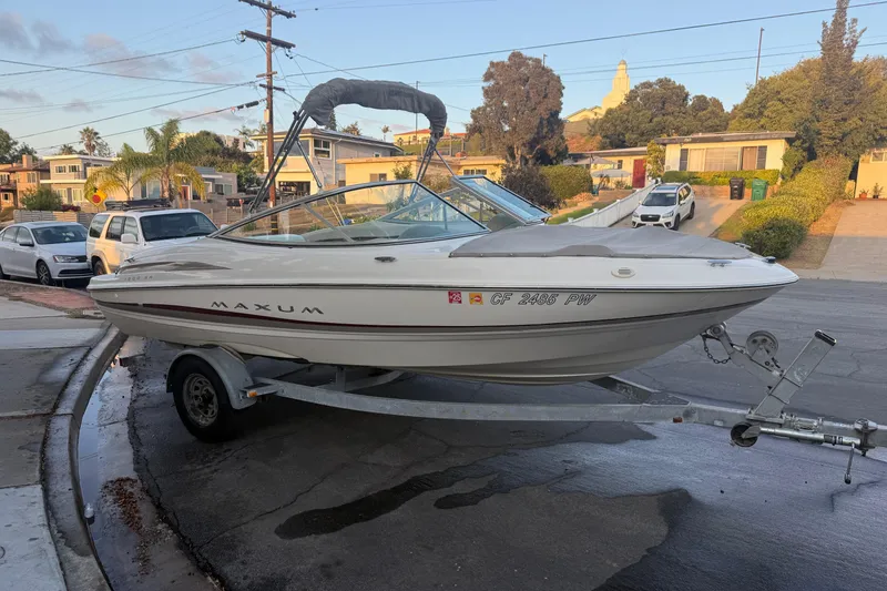 Slide: The Image of 2002 Maxum 1900 SR boat on trailer in suburban neighborhood. - 3