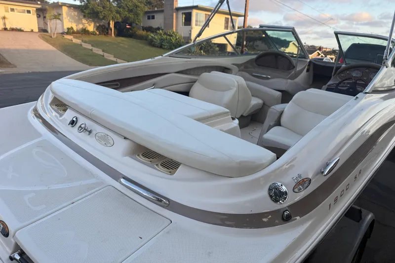 Slide: The Image of 2002 Maxum 1900 SR boat interior with white seating and dashboard view. - 4