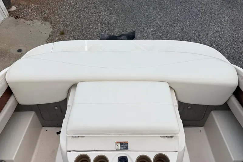 Slide: The Image of 2002 Maxum 1900 SR boat interior with white seating and cup holders. - 6