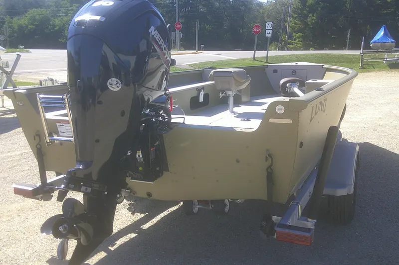 Slide: The Image of 2026 Lund 1875 Alaskan Tiller boat with Mercury outboard motor on trailer. - 11